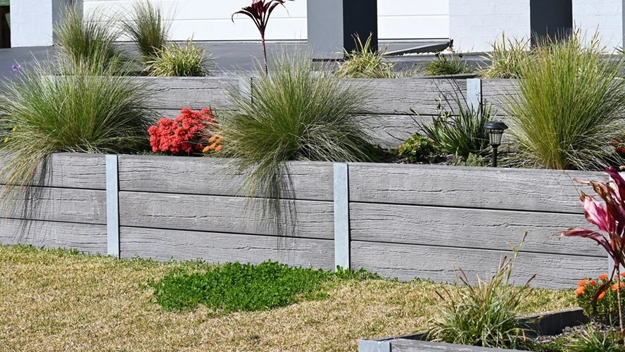 Hardscape - Modern raised garden beds with decorative grasses and colourful flowering plants